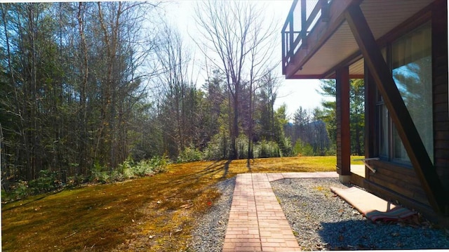 view of yard featuring a view of trees