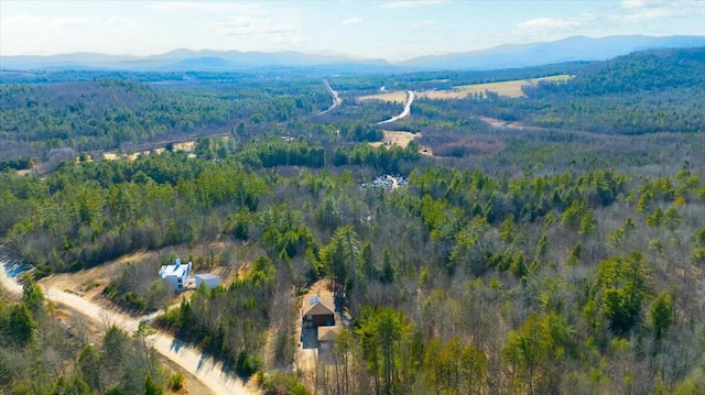 bird's eye view featuring a mountain view and a view of trees