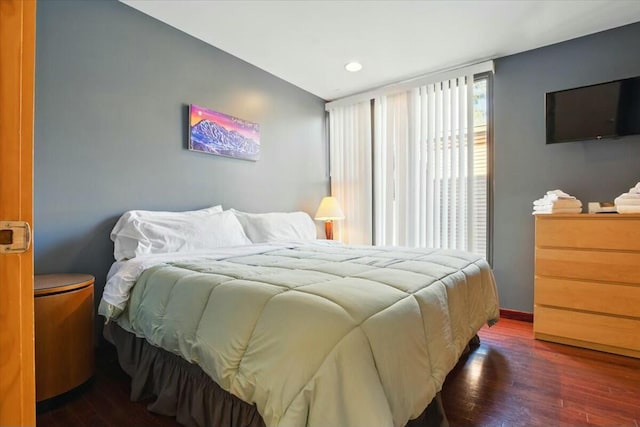 bedroom with wood-type flooring, baseboards, and recessed lighting
