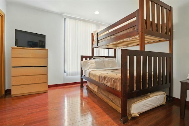 bedroom featuring hardwood / wood-style flooring, baseboards, and recessed lighting