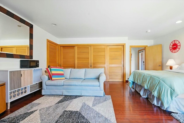 bedroom featuring dark wood finished floors and recessed lighting