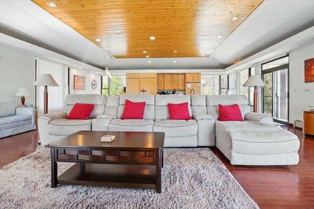 living room featuring a tray ceiling, wood finished floors, wood ceiling, and recessed lighting