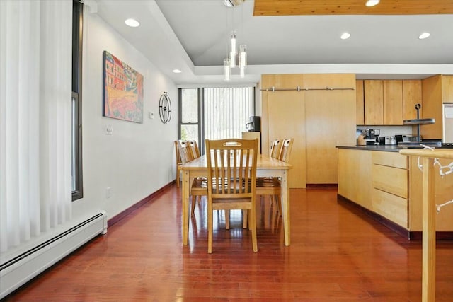 dining room featuring a baseboard radiator, dark wood-style floors, and recessed lighting