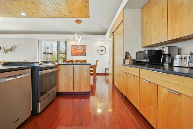 kitchen featuring dark wood-style flooring, dark countertops, wood ceiling, appliances with stainless steel finishes, and hanging light fixtures