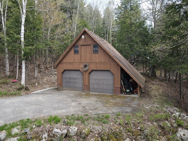 823 Grindstone Rd, Medway, ME 04460 - detached garage featuring a wooded view