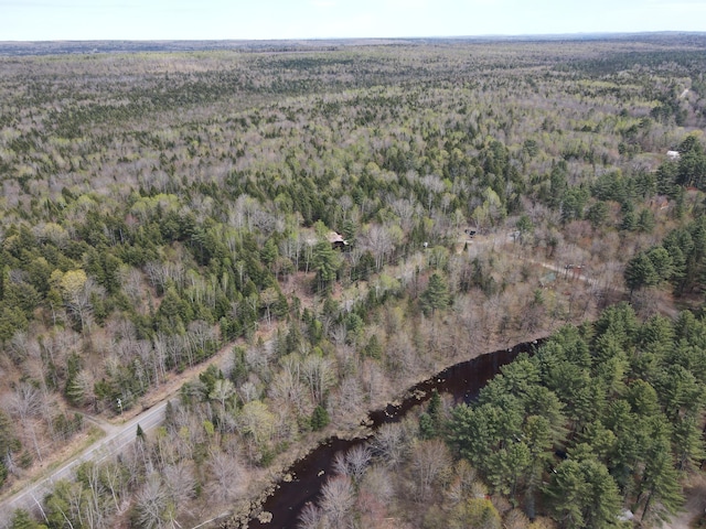 823 Grindstone Rd, Medway, ME 04460 - aerial view of property and surrounding area featuring a heavily wooded area