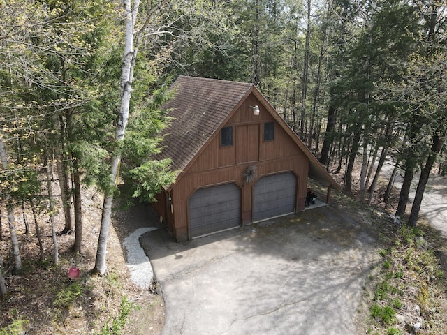 823 Grindstone Rd, Medway, ME 04460 - garage with a garage and a forest view