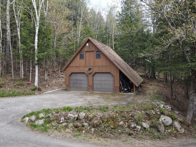 823 Grindstone Rd, Medway, ME 04460 - detached garage featuring a view of trees