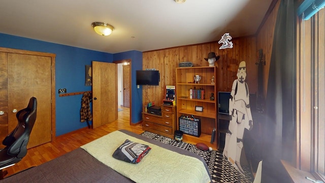 823 Grindstone Rd, Medway, ME 04460 - bedroom featuring wooden walls and wood finished floors