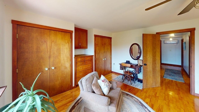 823 Grindstone Rd, Medway, ME 04460 - living area featuring a ceiling fan, light wood-style floors, and baseboards
