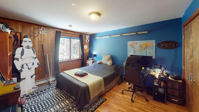 823 Grindstone Rd, Medway, ME 04460 - bedroom with a baseboard radiator, a desk, and wood finished floors