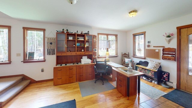 823 Grindstone Rd, Medway, ME 04460 - home office with light wood-style floors, healthy amount of natural light, and baseboard heating