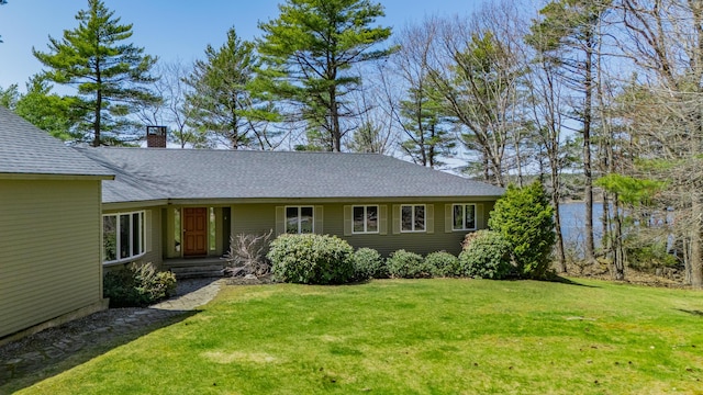 126 Middle Rd, Woolwich, ME 04579 - view of front of property featuring roof with shingles, a front yard, and a chimney