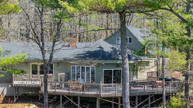 126 Middle Rd, Woolwich, ME 04579 - rear view of house featuring roof with shingles, a chimney, and a deck