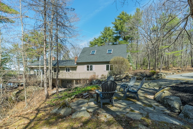 126 Middle Rd, Woolwich, ME 04579 - rear view of property featuring a deck, a chimney, and roof with shingles