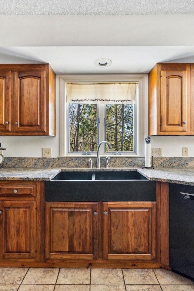 126 Middle Rd, Woolwich, ME 04579 - kitchen with a sink, brown cabinetry, light tile patterned floors, and dishwasher