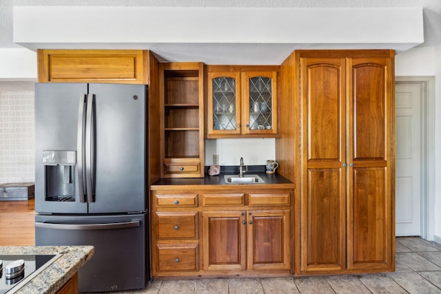 126 Middle Rd, Woolwich, ME 04579 - kitchen with stainless steel fridge, brown cabinets, and a sink