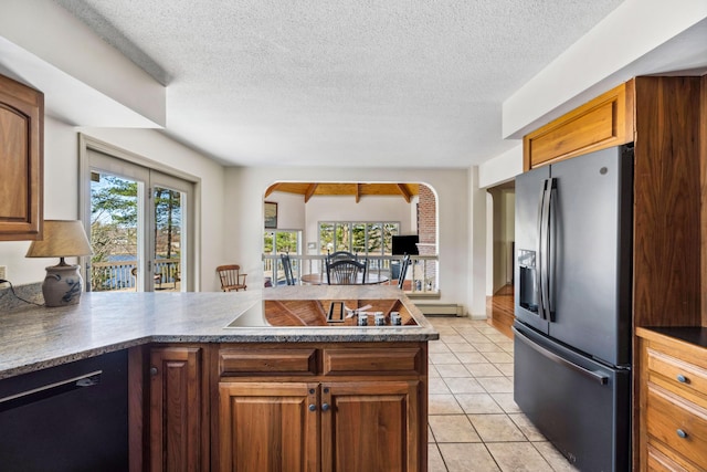 126 Middle Rd, Woolwich, ME 04579 - kitchen with plenty of natural light, black electric cooktop, stainless steel fridge with ice dispenser, a peninsula, and dishwashing machine