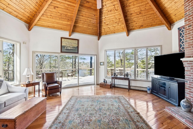 126 Middle Rd, Woolwich, ME 04579 - living room with baseboard heating, beam ceiling, high vaulted ceiling, wooden ceiling, and hardwood / wood-style floors