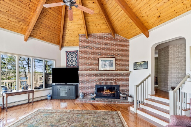 126 Middle Rd, Woolwich, ME 04579 - living room with baseboard heating, high vaulted ceiling, beamed ceiling, and hardwood / wood-style flooring
