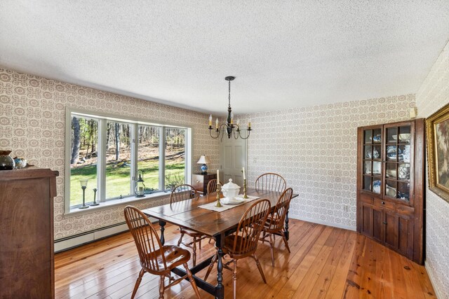 126 Middle Rd, Woolwich, ME 04579 - dining space with wallpapered walls and light wood-style floors