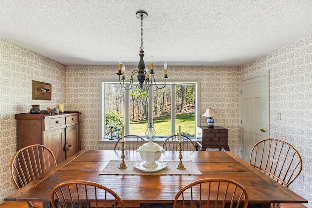 126 Middle Rd, Woolwich, ME 04579 - dining area featuring a textured ceiling, wallpapered walls, and a chandelier