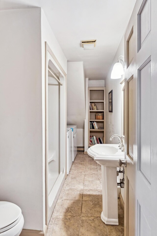 126 Middle Rd, Woolwich, ME 04579 - full bathroom with visible vents, built in features, washing machine and dryer, toilet, and a shower stall