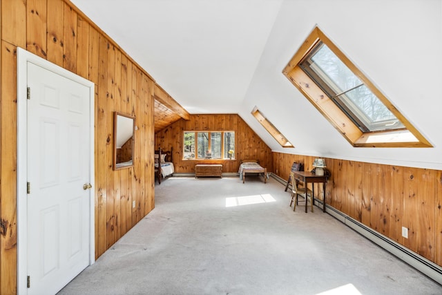 126 Middle Rd, Woolwich, ME 04579 - additional living space with wood walls, carpet, vaulted ceiling with skylight, and a baseboard radiator
