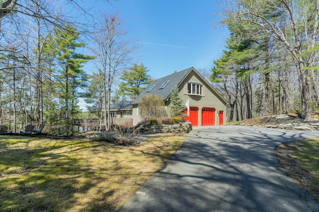 126 Middle Rd, Woolwich, ME 04579 - view of side of property with a shingled roof, an attached garage, and driveway