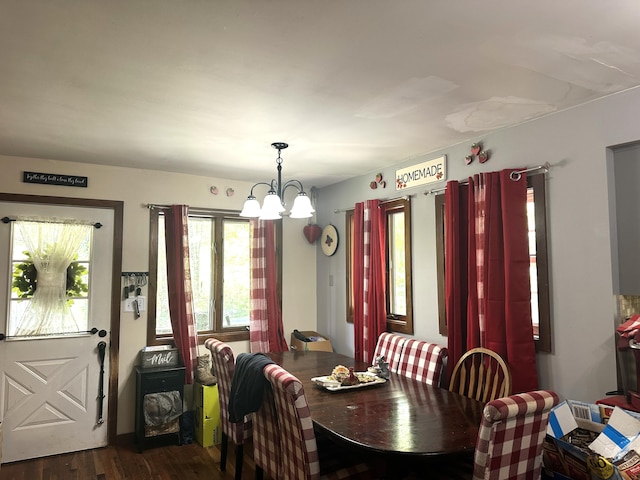 932 Bunker Hill Rd, Jefferson, ME 04348 - dining space featuring a chandelier and dark wood-style floors