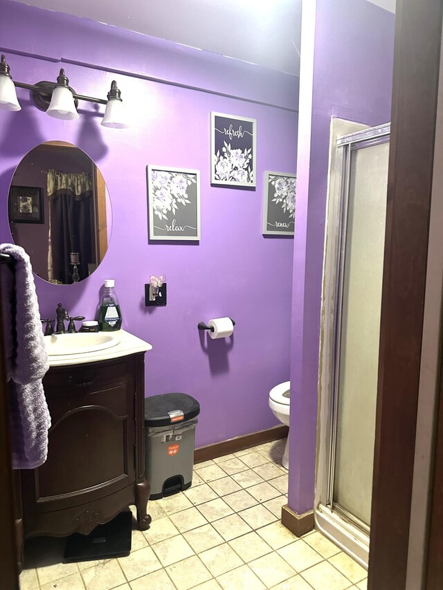 932 Bunker Hill Rd, Jefferson, ME 04348 - bathroom featuring toilet, a stall shower, vanity, and tile patterned floors