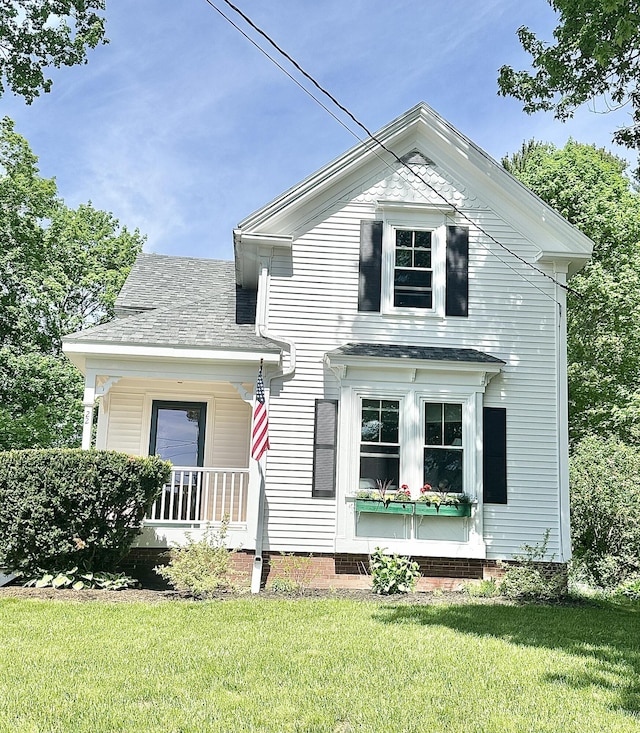 22 Mills Rd, Newcastle, ME 04553 - view of front facade with a front lawn and covered porch
