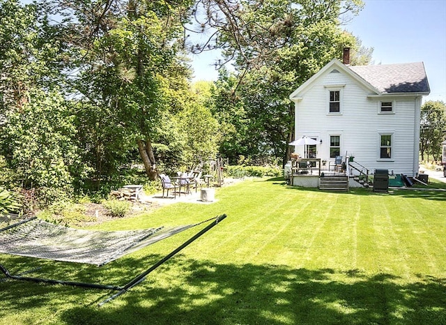 22 Mills Rd, Newcastle, ME 04553 - view of green lawn with a deck