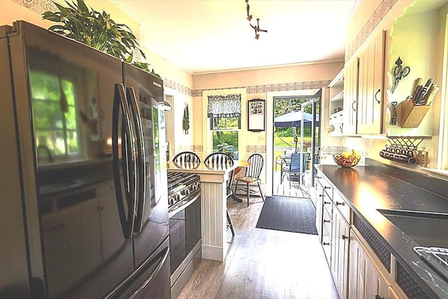 22 Mills Rd, Newcastle, ME 04553 - kitchen featuring stainless steel gas range oven, freestanding refrigerator, dark wood finished floors, and open shelves