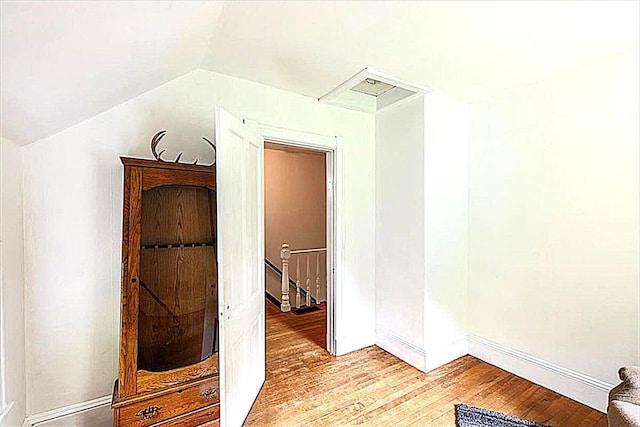 22 Mills Rd, Newcastle, ME 04553 - hall with an upstairs landing, light wood finished floors, and vaulted ceiling