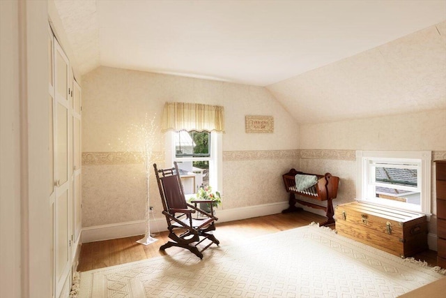 22 Mills Rd, Newcastle, ME 04553 - sitting room with wood finished floors, lofted ceiling, and wallpapered walls