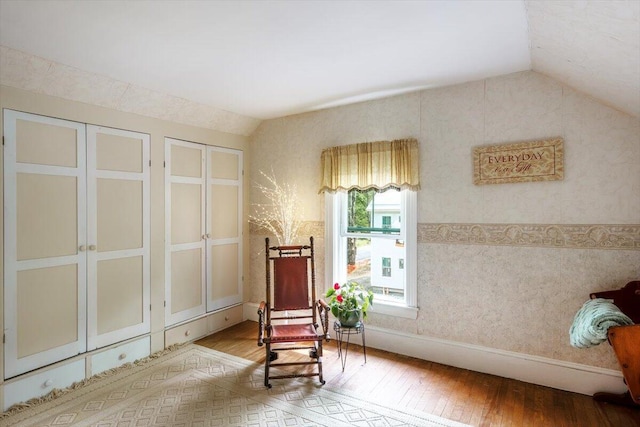 22 Mills Rd, Newcastle, ME 04553 - sitting room featuring lofted ceiling, wood-type flooring, and wallpapered walls