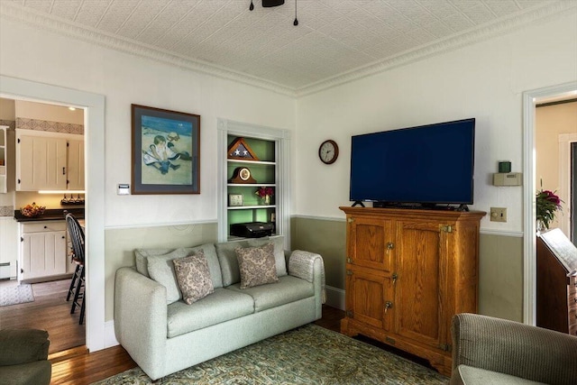 22 Mills Rd, Newcastle, ME 04553 - living area featuring crown molding, dark wood-type flooring, and wainscoting