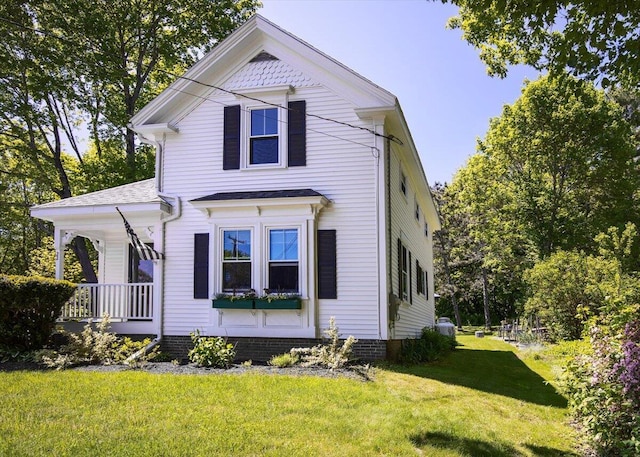 22 Mills Rd, Newcastle, ME 04553 - view of front facade with a front lawn and covered porch