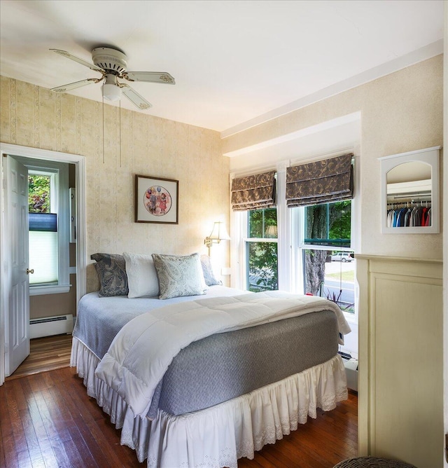 22 Mills Rd, Newcastle, ME 04553 - bedroom with baseboard heating, multiple windows, and hardwood / wood-style flooring