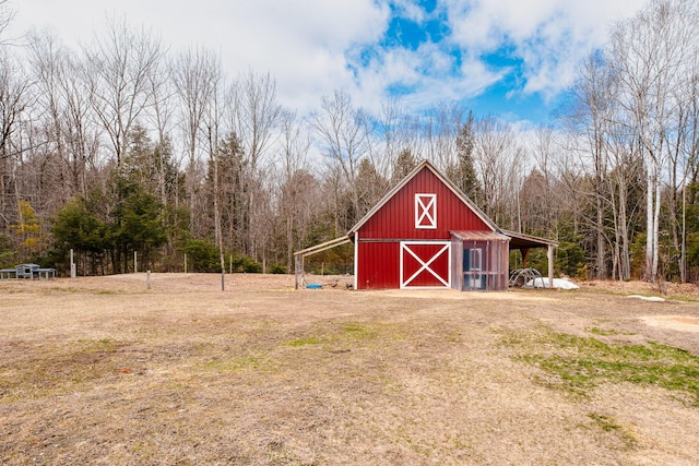 129 Bailey Hill Rd, New Sharon, ME 04955 - view of barn featuring a view of trees