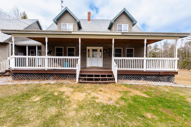 129 Bailey Hill Rd, New Sharon, ME 04955 - farmhouse featuring a front yard, a shingled roof, and a chimney