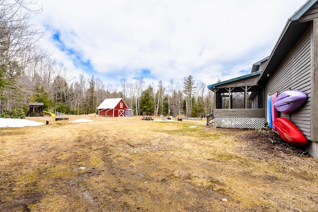 129 Bailey Hill Rd, New Sharon, ME 04955 - view of yard featuring a sunroom, an outbuilding, and a barn