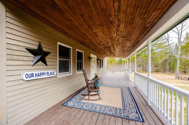 129 Bailey Hill Rd, New Sharon, ME 04955 - wooden terrace with covered porch