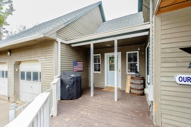 129 Bailey Hill Rd, New Sharon, ME 04955 - wooden deck with a garage and grilling area