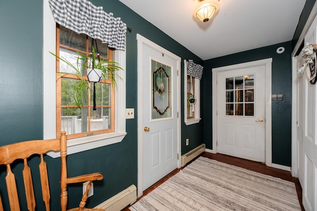 129 Bailey Hill Rd, New Sharon, ME 04955 - foyer entrance with baseboards, wood finished floors, and a baseboard radiator
