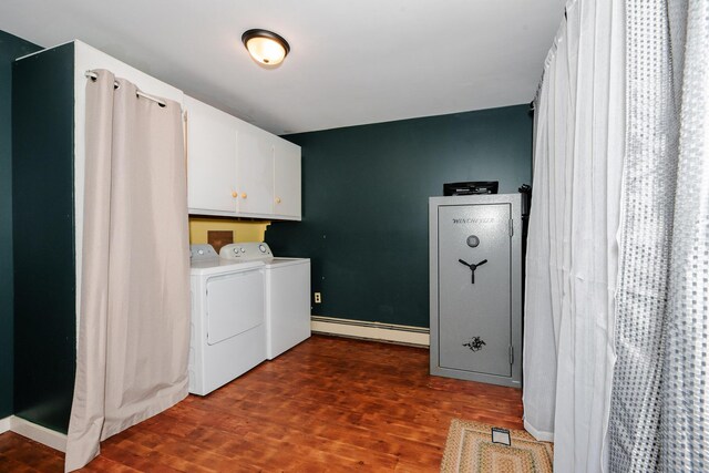 129 Bailey Hill Rd, New Sharon, ME 04955 - laundry area with a baseboard heating unit, dark wood finished floors, washing machine and dryer, and cabinet space