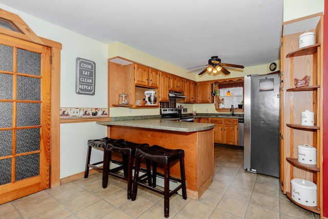 129 Bailey Hill Rd, New Sharon, ME 04955 - kitchen with under cabinet range hood, stainless steel appliances, a sink, a peninsula, and ceiling fan