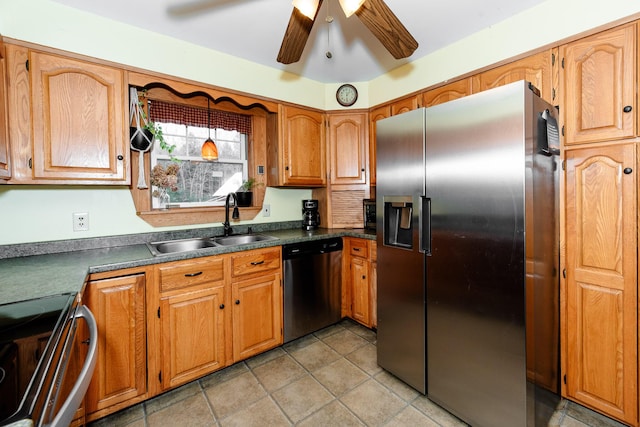 129 Bailey Hill Rd, New Sharon, ME 04955 - kitchen with dark countertops, a sink, brown cabinetry, appliances with stainless steel finishes, and ceiling fan