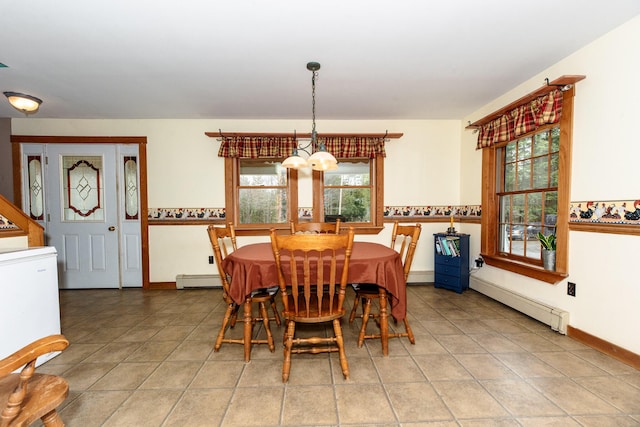 129 Bailey Hill Rd, New Sharon, ME 04955 - dining area with a baseboard heating unit, plenty of natural light, a chandelier, and a baseboard radiator
